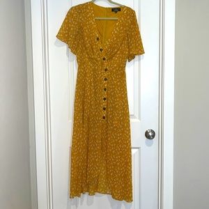 Asymmetrical high-low yellow dress with white floral print